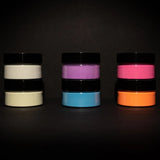 Stacked jars of 6-color glow in the dark pigment powder in electric green, blue, yellow, orange, purple, and cyan—non-toxic, premium formula ready to buy for murals, epoxy resin, and clay crafts