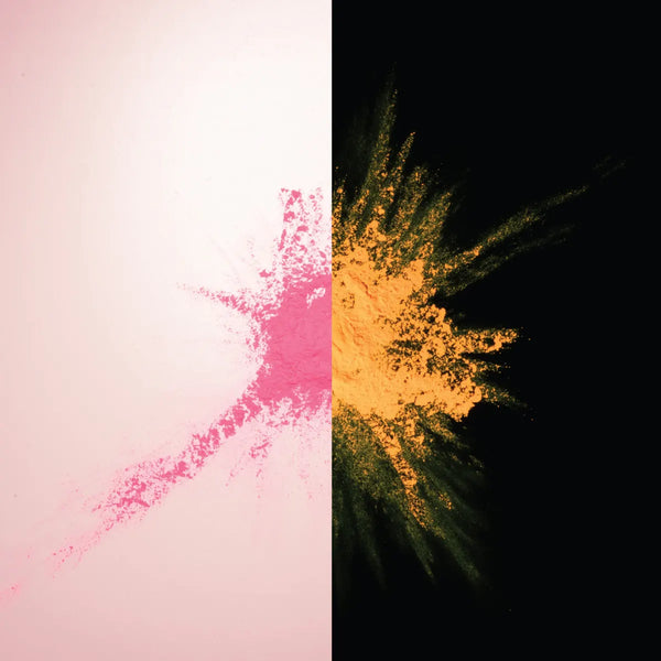 Glow-in-the-dark Pastel Pink to Orange pigment powder bursting in a fine neon spray—delivering ultra-bright, durable orange glow for party décor, halloween pumpkin, safety markings, and premium DIY crafts