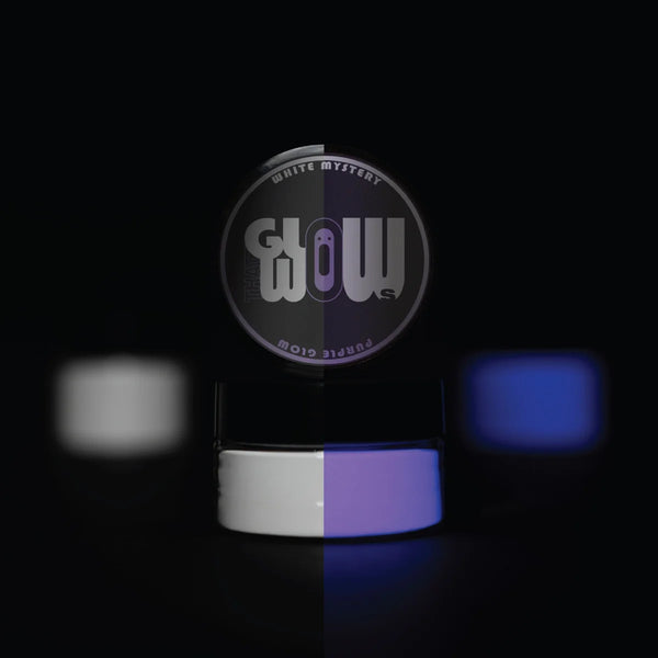 UV-reactive White Mystery pigment powder jar half in daylight (clear white) and half glowing purple under blacklight—premium phosphorescent powder for durable, high-intensity glow in epoxy and craft projects