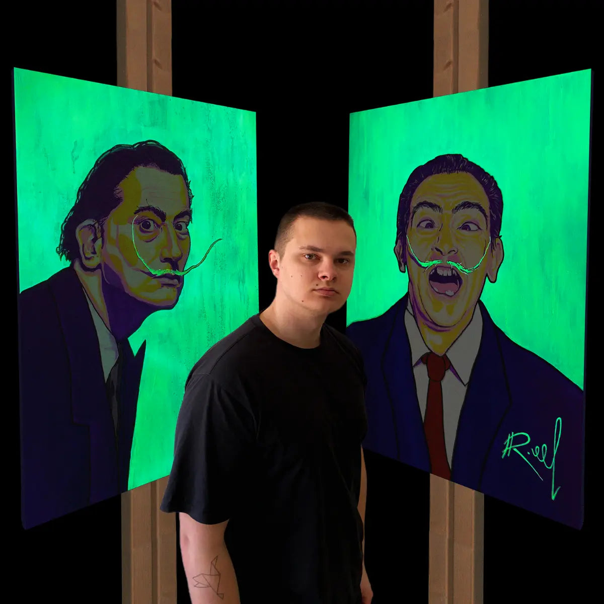 artist standing in front of his artwork that glows in the dark