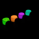 Charged strontium aluminate glow paint in four jars neatly arranged—delivering intense, long-lasting glow under UV or sunlight