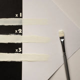 Brush strokes of clear white-to-green glow in the dark strontium aluminate paint applied in one, two, and three coats—engineered for smooth finish, maximum opacity, and strongest glow-to-color ratio