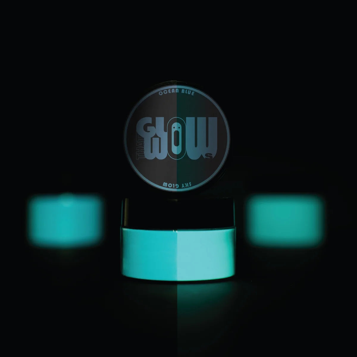 Strontium aluminate Ocean Blue to Sky pigment powder jar with neon aqua spots—industrial-grade formula engineered for maximum glow retention in epoxy, nail art, and outdoor décor