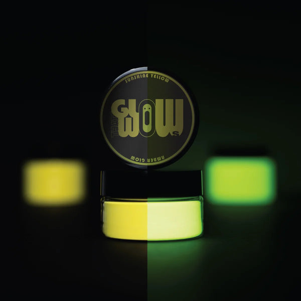 Strontium aluminate Yellow to Amber glow pigment powder bursting in a fine cloud—industrial-grade formula for ultra-bright, long-lasting luminescence on canvas, fabric, and outdoor signage