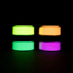 Static pyramid of four blacklight-reactive acrylic paint jars on a dark surface—perfect for bold, high-contrast UV art creations.