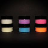 Static pyramid of six blacklight-reactive acrylic paint jars on a dark backdrop—perfect for creating bold, high-contrast UV art