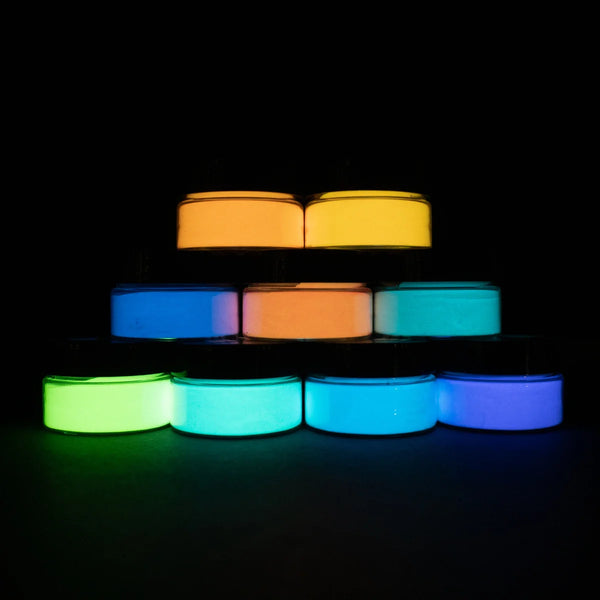 Nine-color glow pigment powder pyramid glowing neon green, electric blue, solar yellow, sunset orange, ultraviolet purple, hot pink, lime, aqua, and white—brightest long-lasting formula for epoxy, nail art, and mural projects.