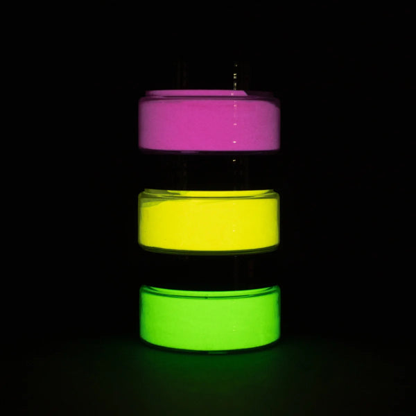 Dark-room shot of a three-jar glow-in-the-dark paint pyramid—showcasing ultra-bright, long-lasting neon yellow, lime green, and hot pink for party décor and nighttime outdoor accents
