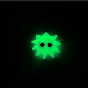 a glow in the dark clay model in night light