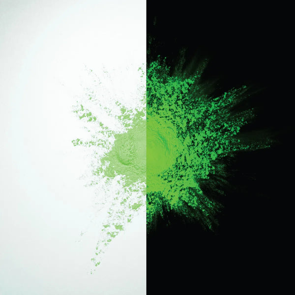 Glow-in-the-dark Light Green to Green pigment powder bursting in a fine neon spray—perfect for safety signage, party décor, and premium DIY crafts requiring vivid, lasting green illumination