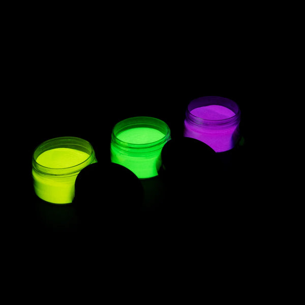 Three open jars of glow-in-the-dark pigment powder in light green, snow white and sky blue glowing under UV light on a black background—perfect for resin art, polymer clay, nail accents, fabric and wood crafts.