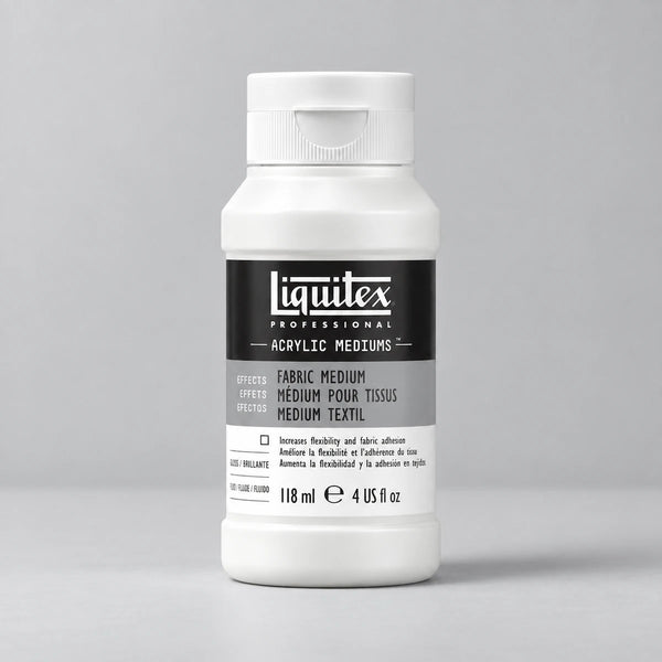 A white plastic bottle of Liguitex Professional Acrylic Mediums, specifically Fabric Medium, on a neutral light gray background.