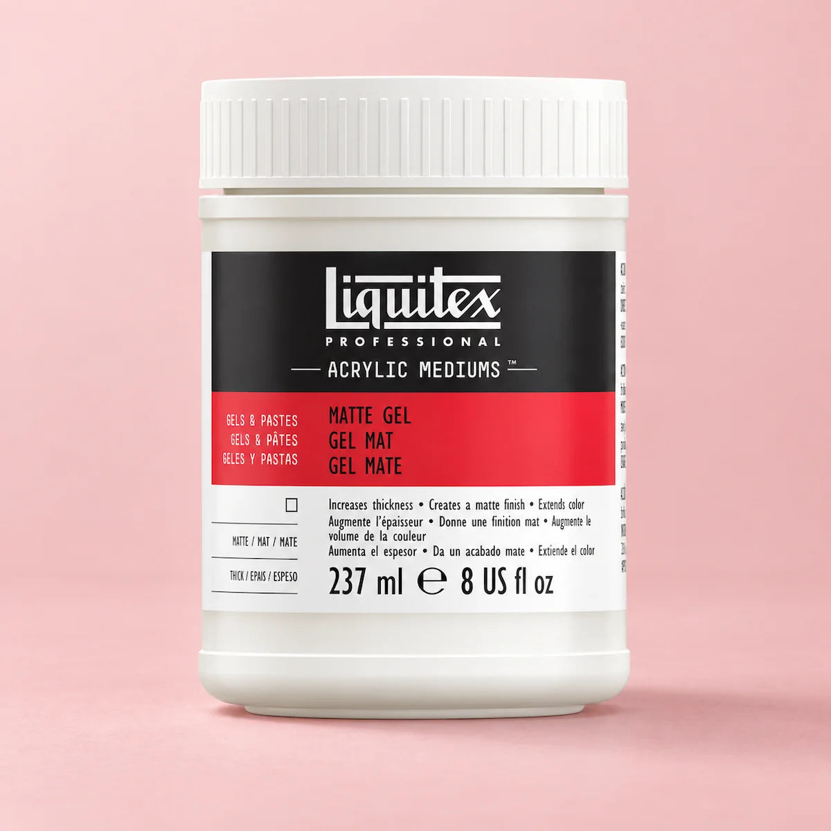A white plastic jar of Liquitex Professional Acrylic Mediums Matte Gel, featuring a black and red label, set against a solid light pink background.