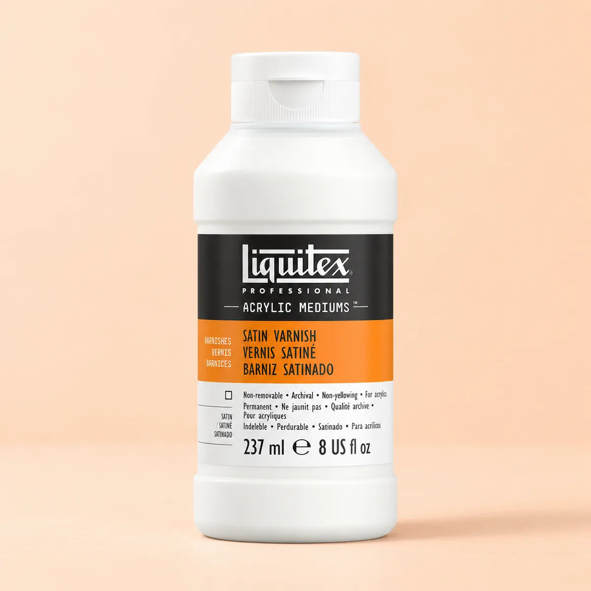 A bottle of Liquitex Professional Satin Varnish acrylic medium in a white plastic container with a black and orange label, set against a solid pale peach background.