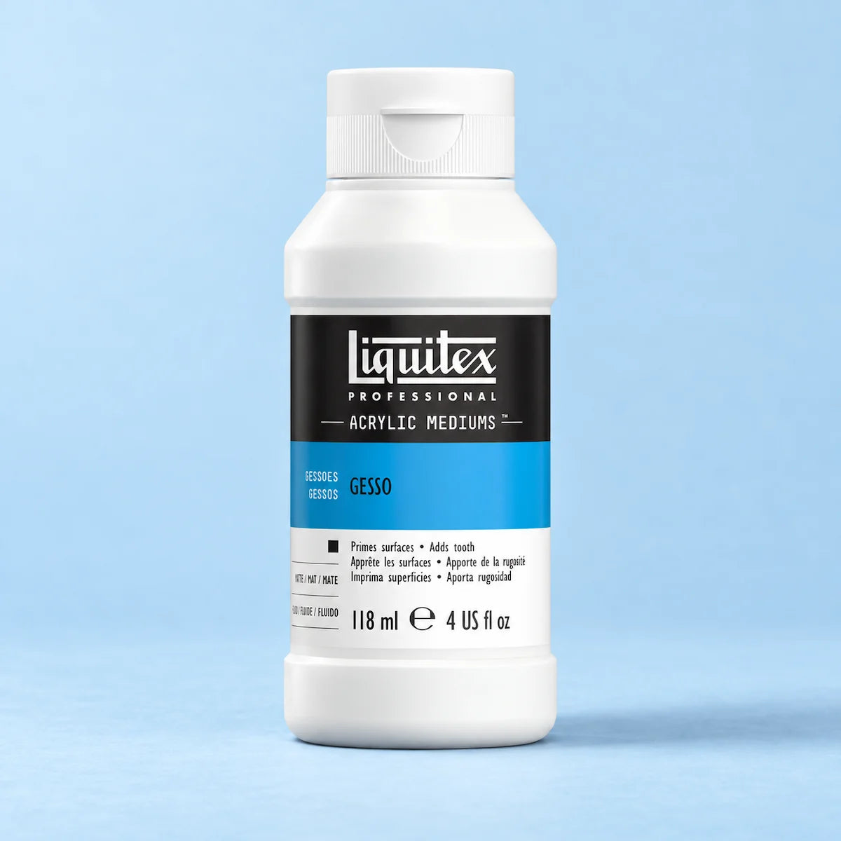 A bottle of Liquitex Professional Cesso acrylic medium in the shade 'Gesso', featuring a white plastic bottle with a black and blue label, set against a light blue background. It helps for glow in the dark paint, by being a white layer that reflects the light.