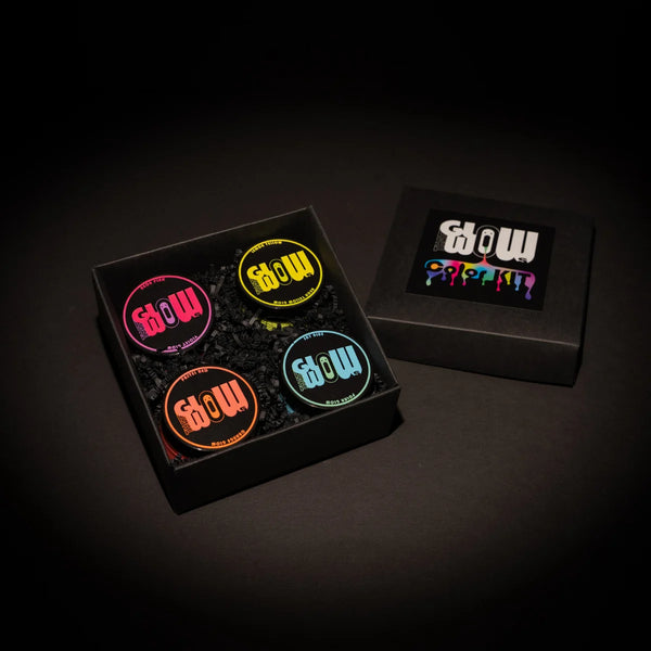 Overhead shot of our 4-color neon acrylic glow paint kit in a sleek black tray—best-in-class, long-lasting luminescent formula