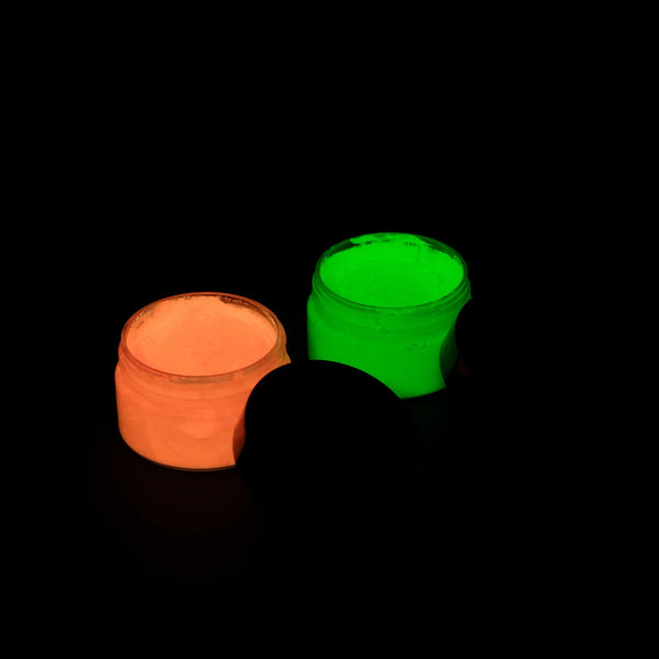 Non-toxic neon pink and green glow pigment pots engineered for durable, long-lasting luminescence in clay, epoxy resin, and DIY craft projects.