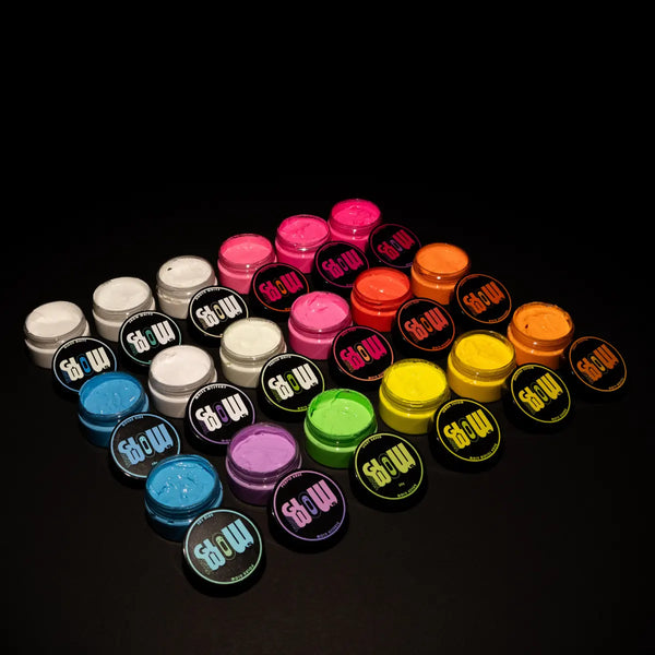 Top-down layout of 18 phosphorescent paint jars showing vibrant hues for resin, clay, canvas, and wood