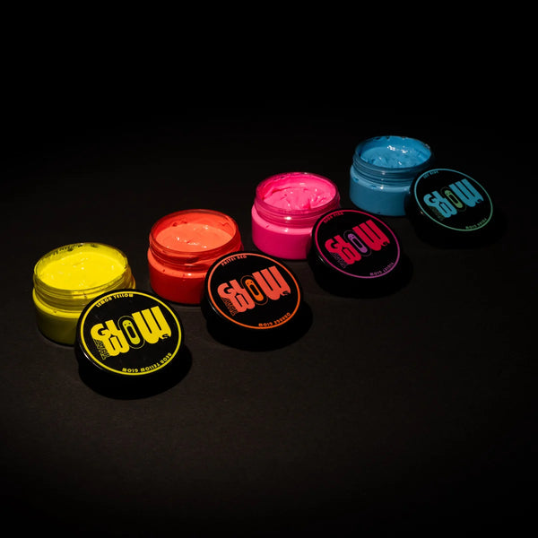 Top-down spread of four open phosphorescent paint jars showcasing vibrant, brightest colors for resin, clay, canvas, and wood