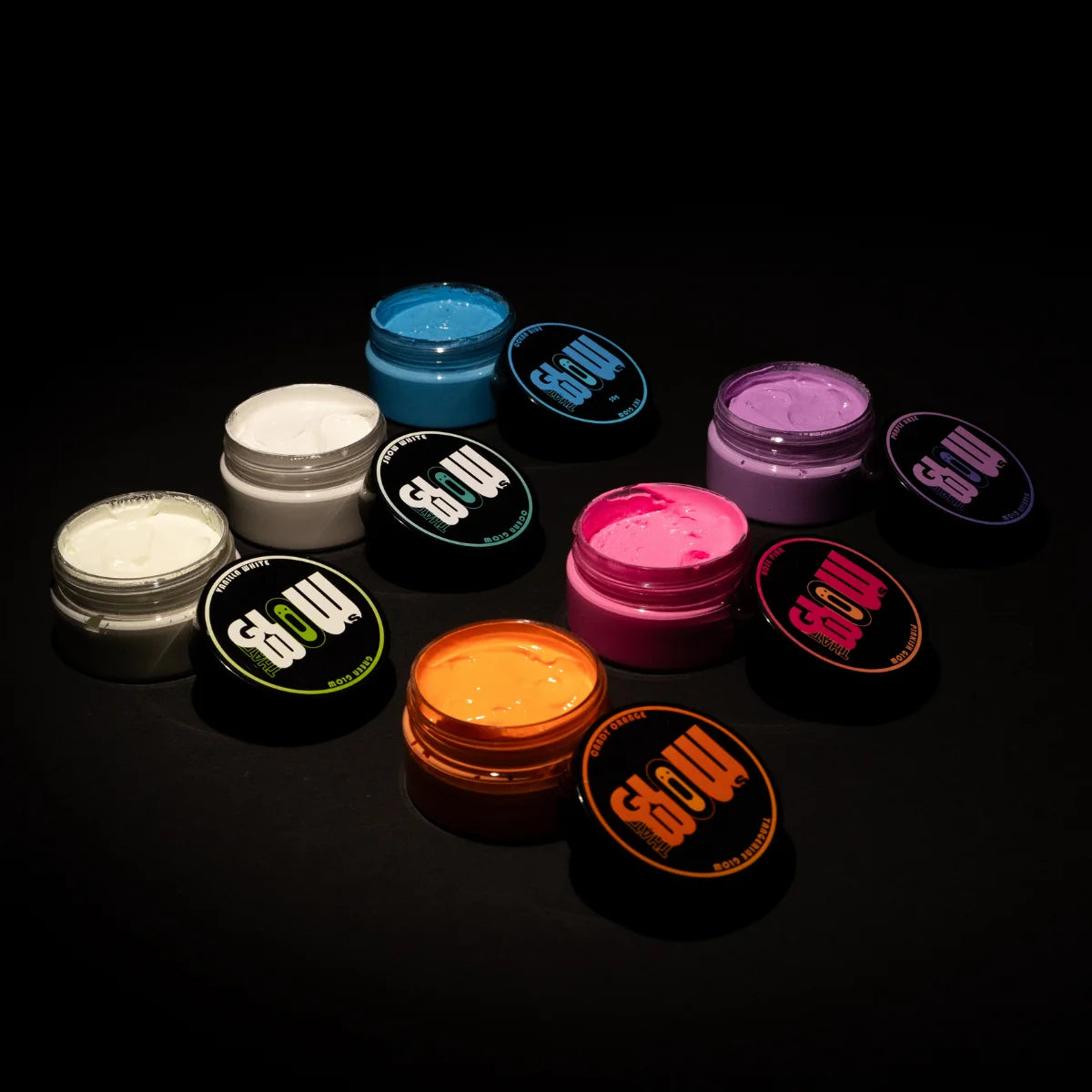 Top-down spread of six open phosphorescent paint jars showing vibrant, long-lasting colors ideal for resin, clay, canvas, and woodTop-down spread of six open phosphorescent paint jars showing vibrant, long-lasting colors ideal for resin, clay, canvas, and wood