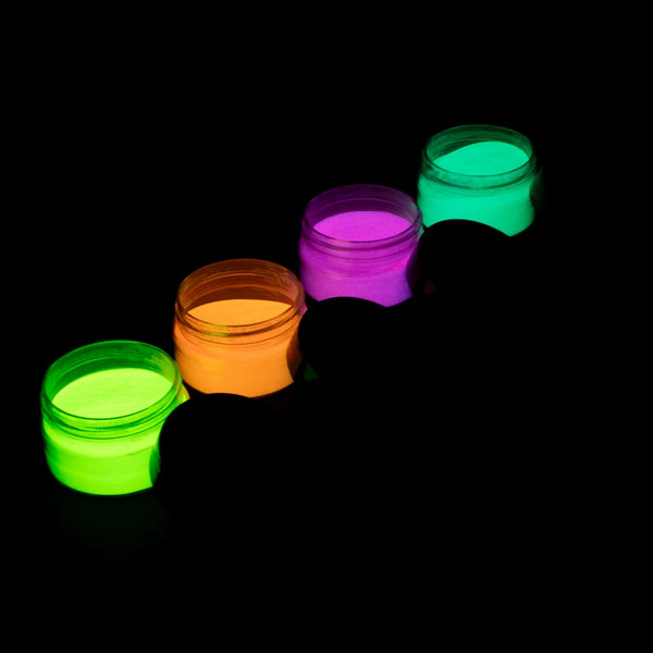 Four open jars of glow-in-the-dark pigment powder in green, orange, purple and blue glowing under UV light on a black background—ideal for resin art, polymer clay, nail accents, fabric printing, wood and outdoor Halloween décor