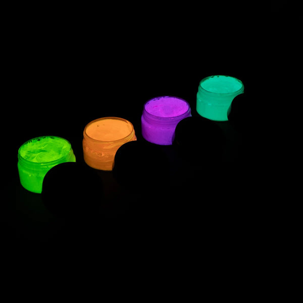 Charged strontium aluminate glow paint in four jars neatly arranged—delivering intense, long-lasting glow under UV or sunlight
