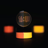 Strontium aluminate Orange-to-Tangerine glow pigment powder bursting in a fine neon cloud—engineered for ultra-bright, long-lasting luminescence in DIY crafts, halloween pumpkins and professional installations