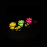 Top-down view of three glow pigment powder jars—light green, snow white and sky blue—with lids beside them, ready for Halloween rock painting, outdoor signage and clothing highlights