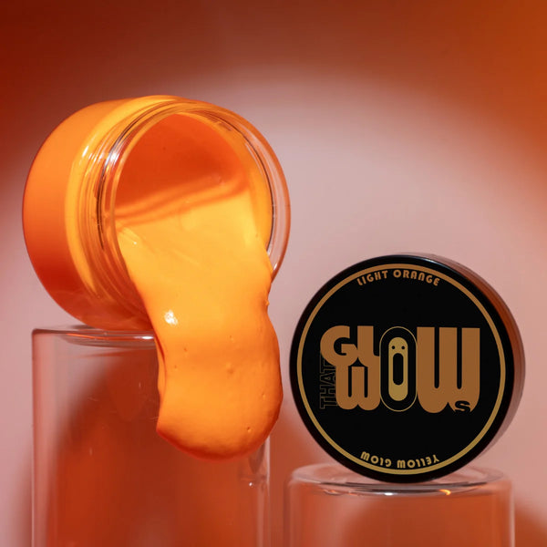 Pouring UV-reactive Orange to Tangerine glow in the dark paint—smooth, non-toxic acrylic perfect for metal art, halloween pumpkin, polymer clay, and fabric with vivid after-dark orange luminescence.